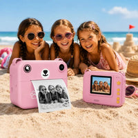Trois fillettes plage avec appareil photo instantané rose impression et ecran recto verso
