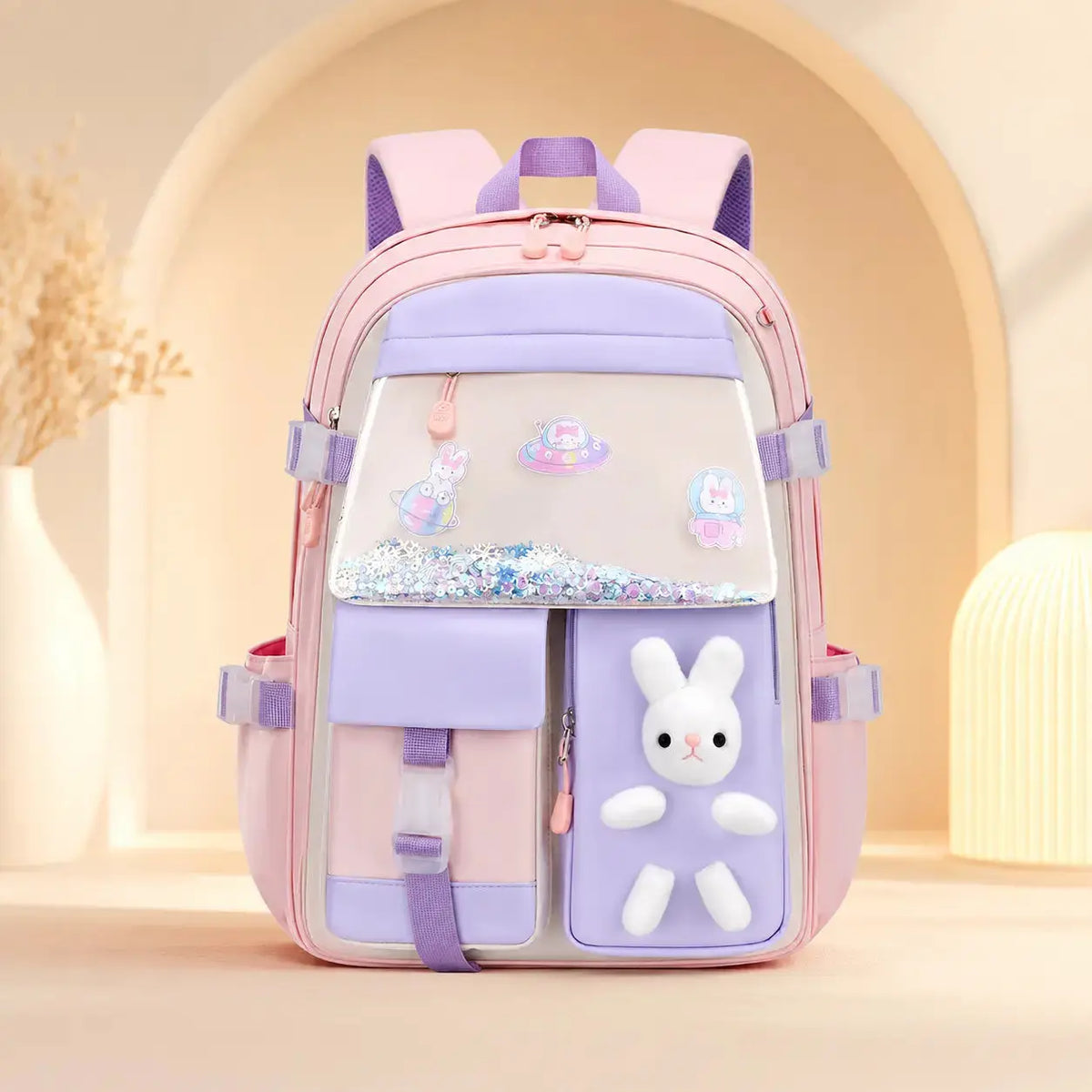 Cartable scolaire fille kawaii rose poudré avec peluche lapin 3D, poche holographique et grande capacité pour la rentrée scolaire.