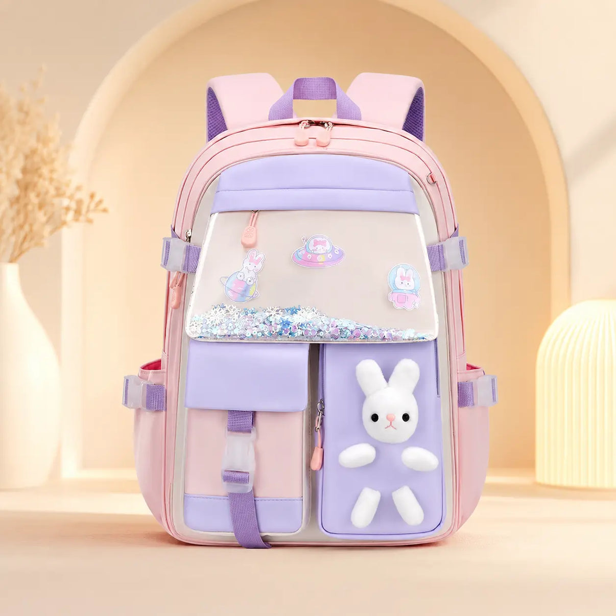 Cartable scolaire fille kawaii rose poudré avec peluche lapin 3D, poche holographique et grande capacité pour la rentrée scolaire.